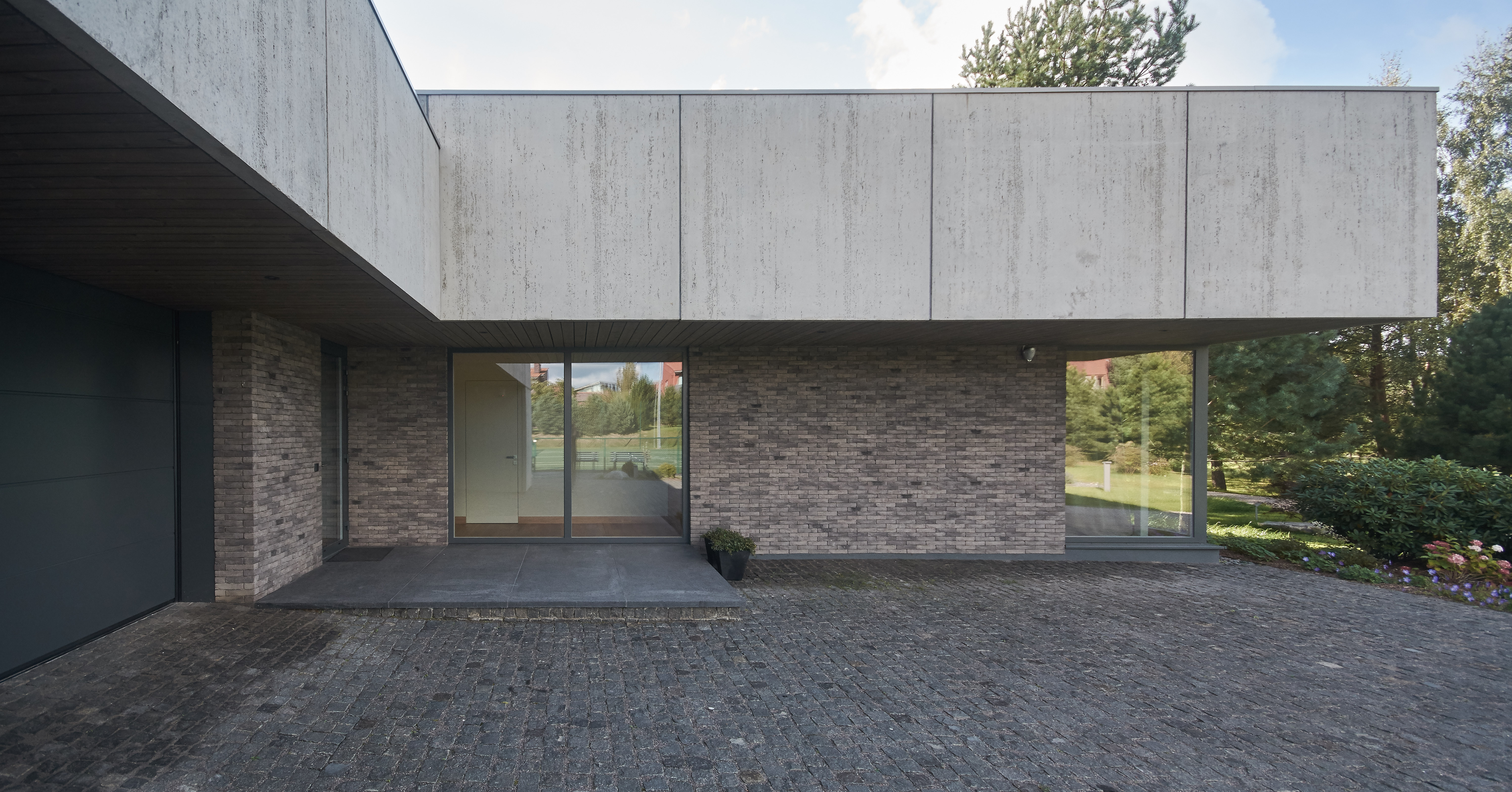 Residential Minimalist Concrete House by NEBRAU - Architizer