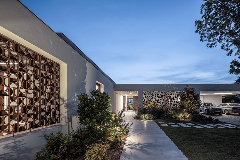 Villa with multiple exits to courtyards and fields by Keren Gans ...