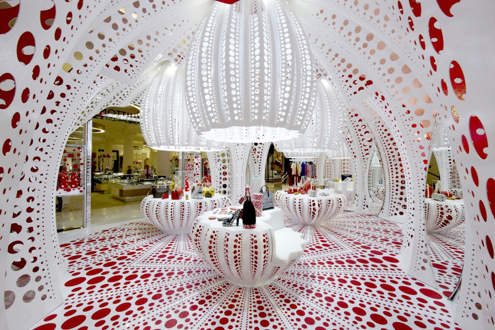 Installation of Yayoi Kusama's mannequin covers the exterior of the Louis  Vuitton's store in Paris