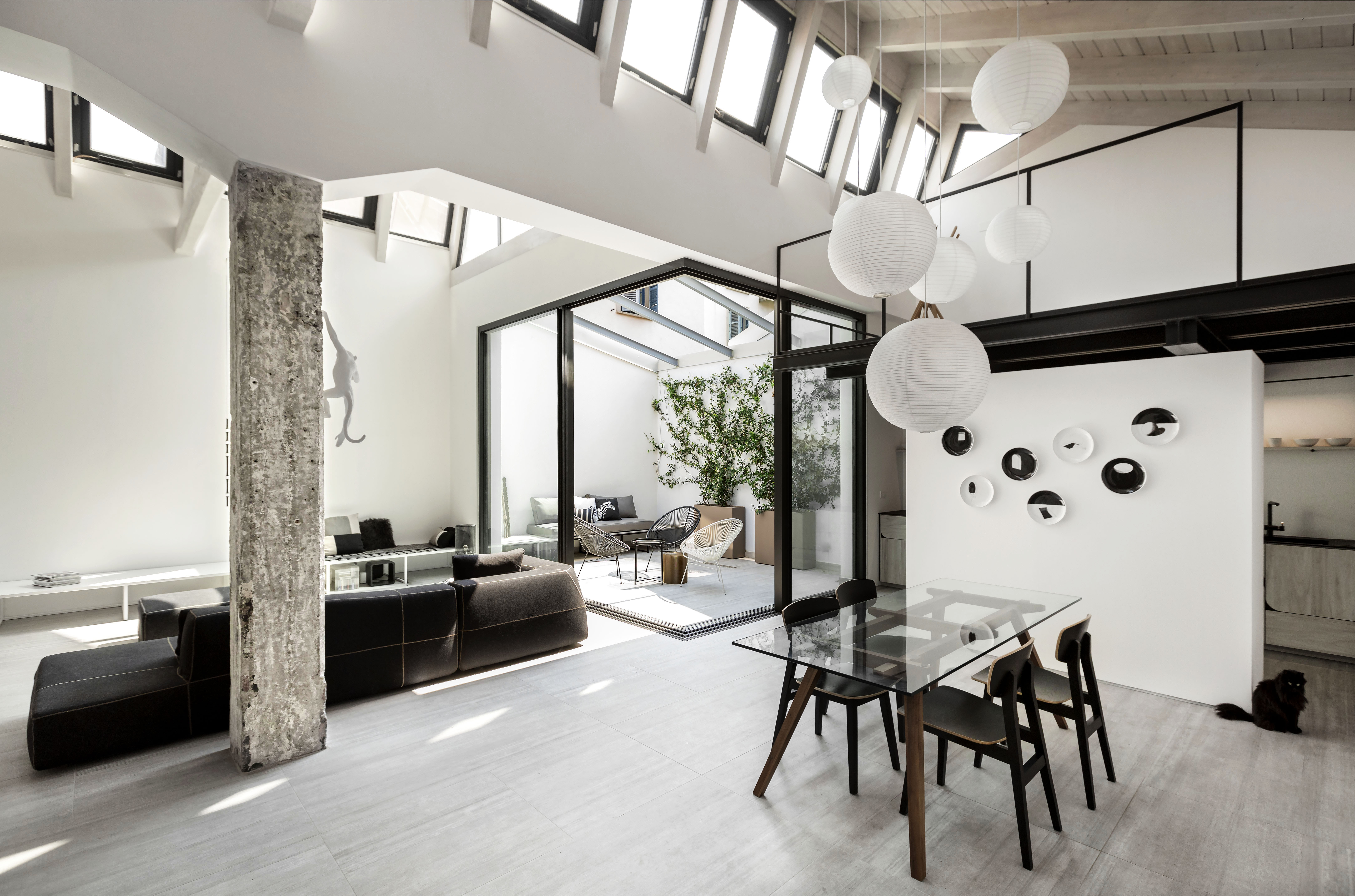 Modern black and white loft apartment tiled with porcelain stoneware 