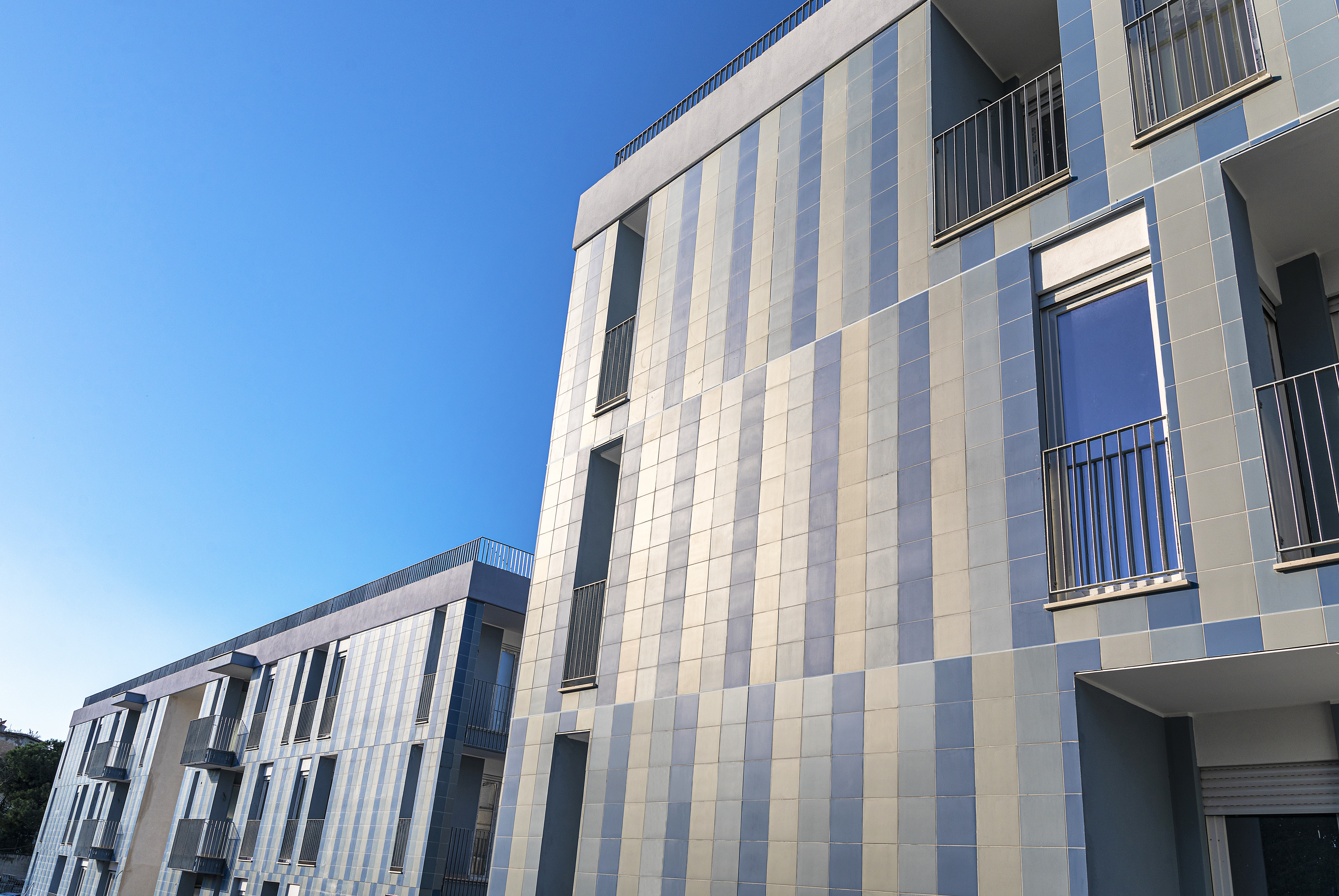 Façade cladding on two residential buildings in Naples