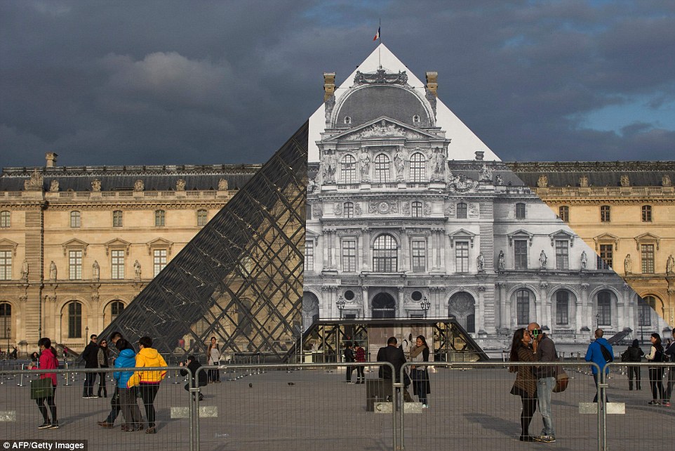 Voilà! Parisian Street Artist JR Makes the Iconic Louvre Pyramid