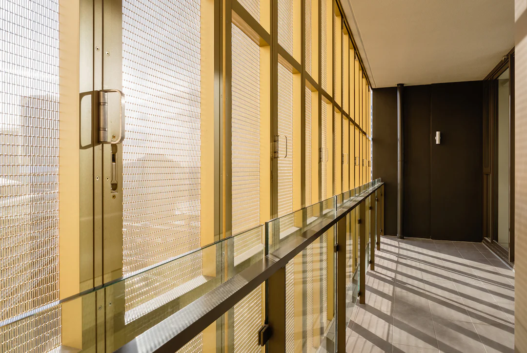Perforated Façades: 7 Buildings Cloaked in Metal Mesh Panels ...