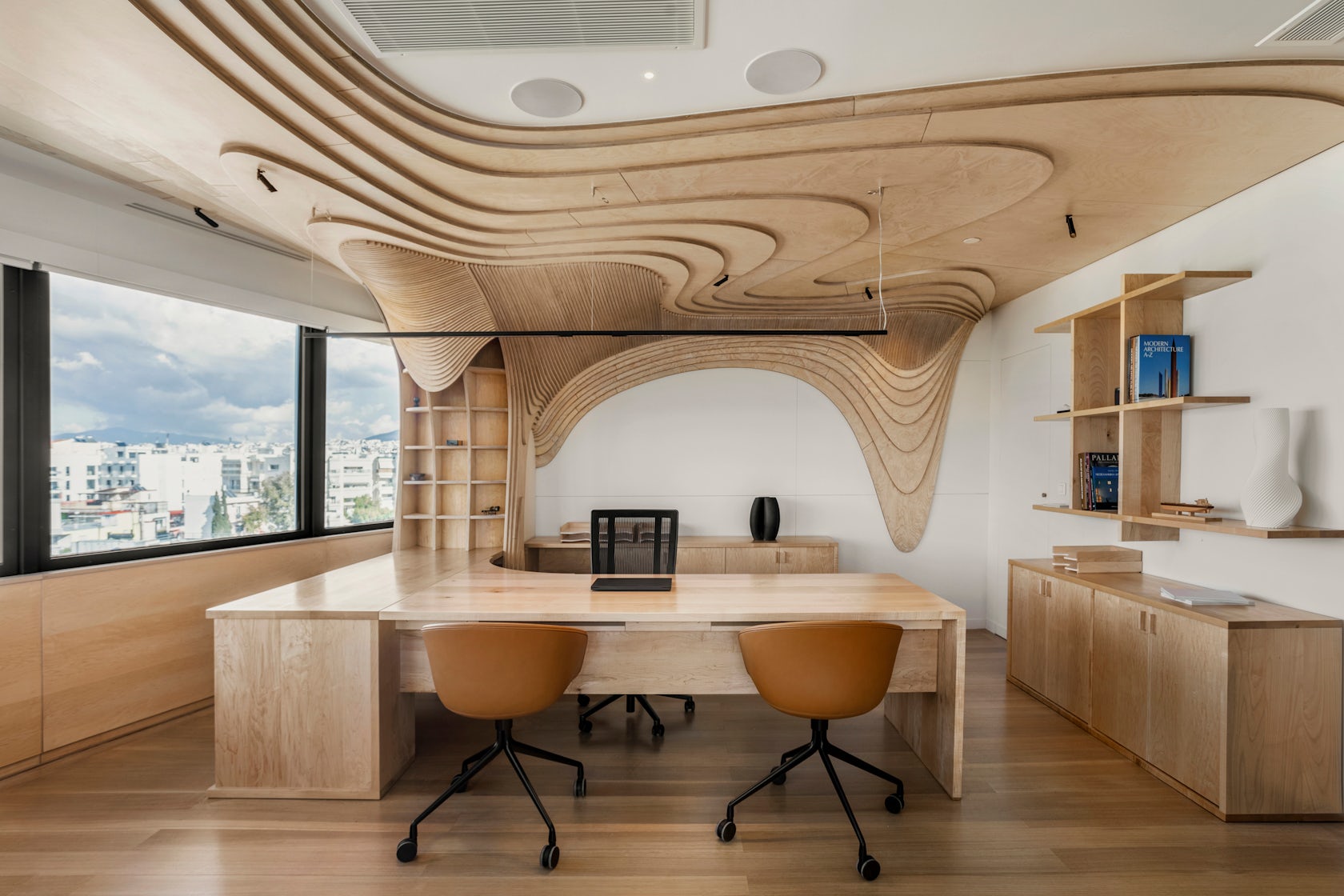 Tenon Architecture Sculpts Fluid Geometric Forms for the ONASSIS GROUP Office Renovation