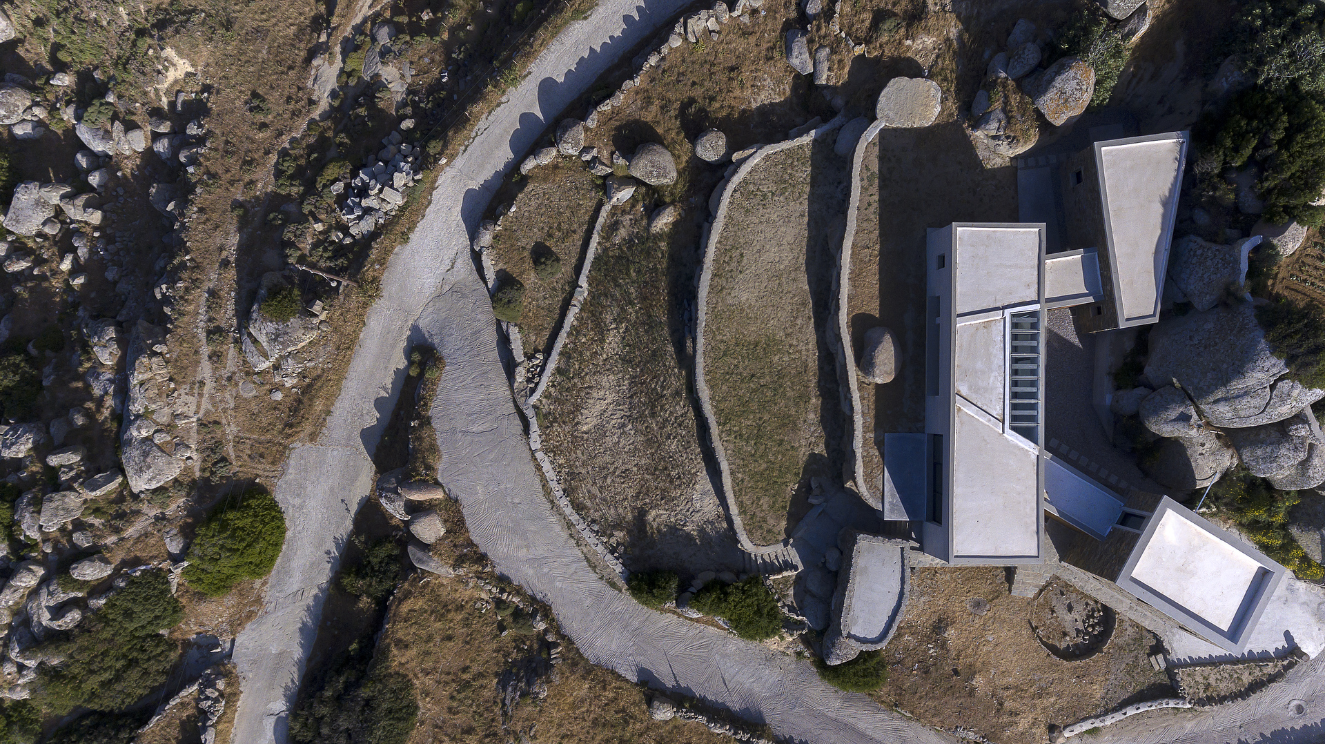 A HOUSE BETWEEN THE ROCKS by ARISTIDES DALLAS ARCHITECTS - Architizer