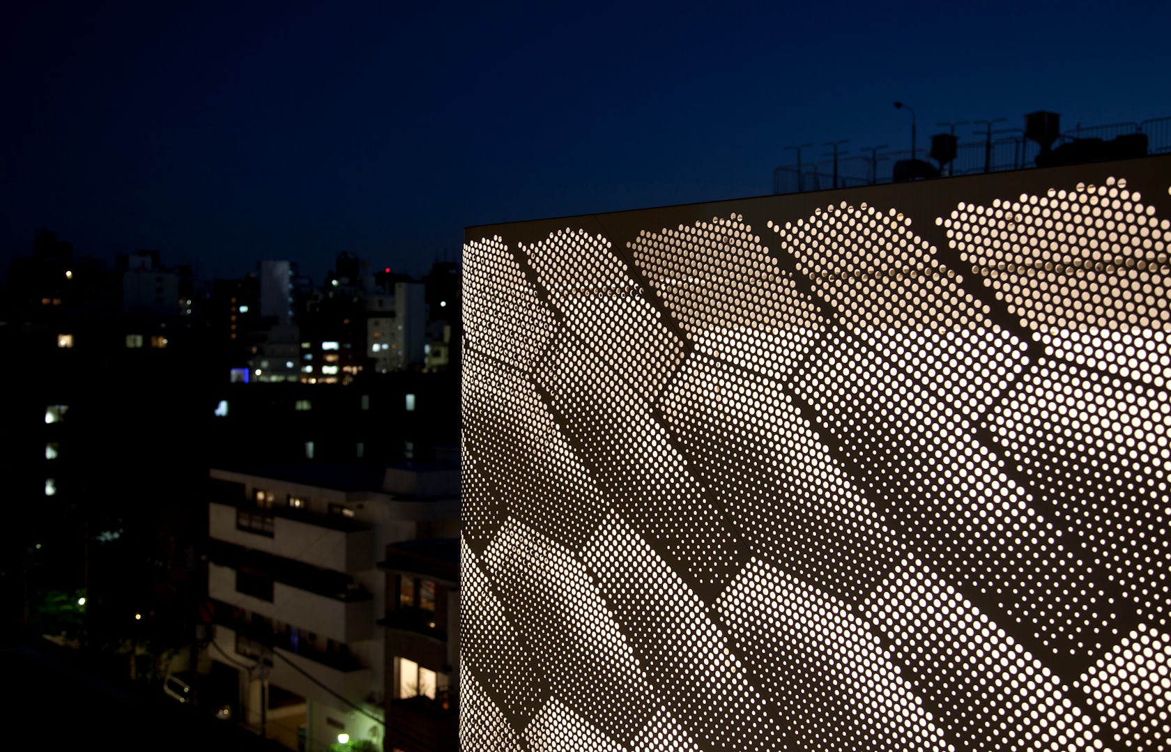 Louis Vuitton store Tokyo designed with perforated monogrammed facade